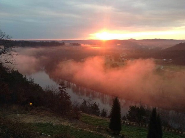 Sunrise with fog rising over the White River